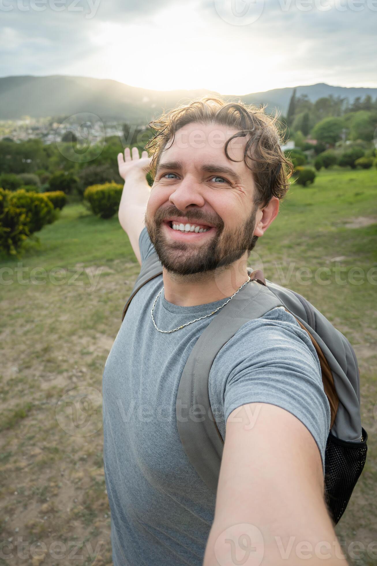 files/young-adult-taking-a-selfie-in-a-natural-tourism-landscape-photo.jpg